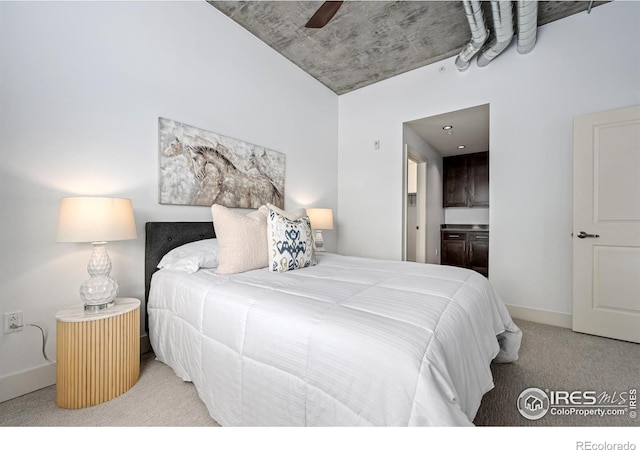 bedroom with a ceiling fan, carpet, baseboards, and ensuite bathroom