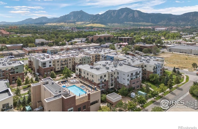 birds eye view of property featuring a mountain view