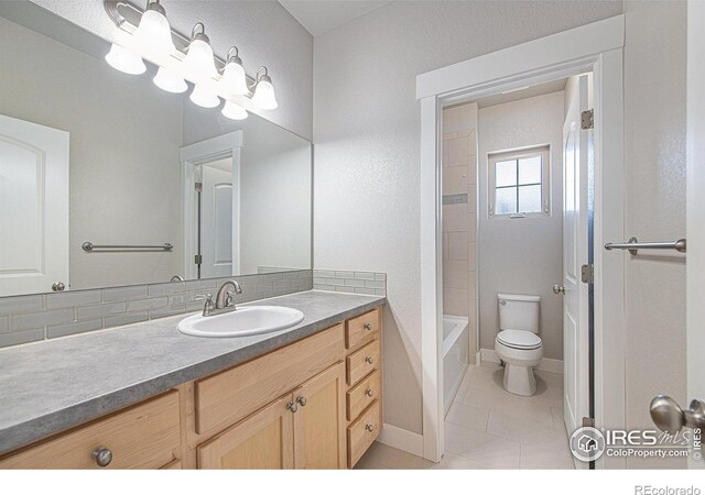 bathroom featuring vanity, toilet, and tile patterned floors