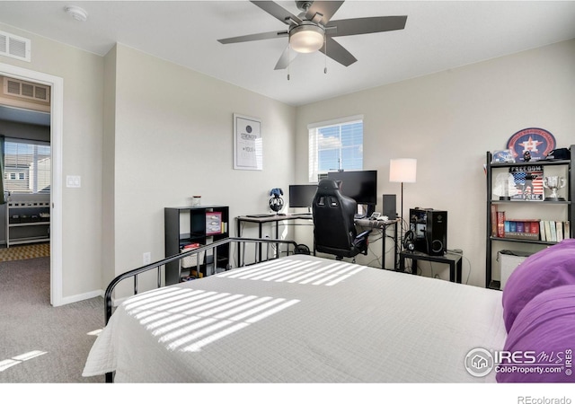 bedroom with ceiling fan and carpet floors