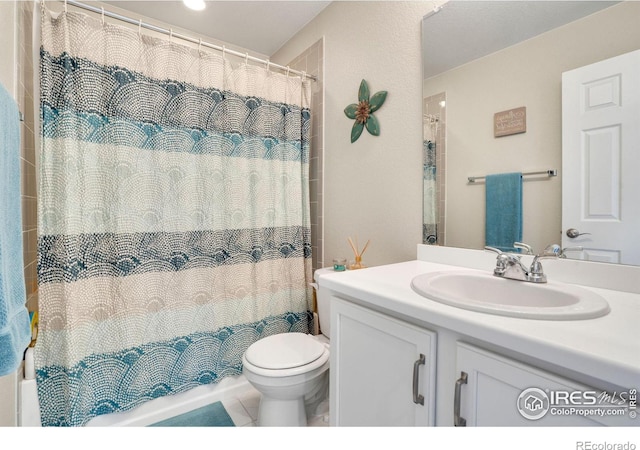 full bathroom with vanity, toilet, tile patterned floors, and shower / bathtub combination with curtain