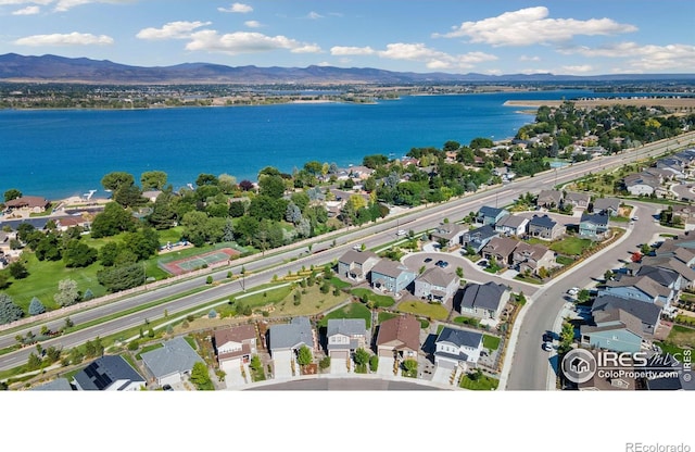 bird's eye view featuring a water and mountain view