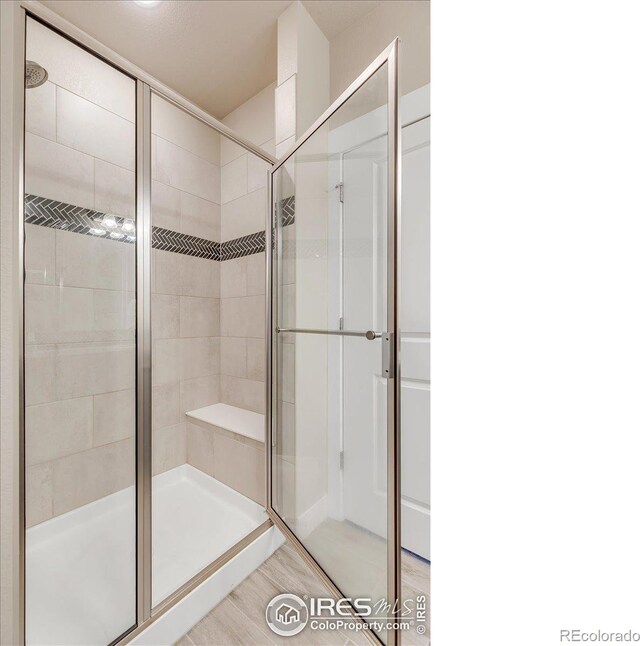 bathroom featuring an enclosed shower