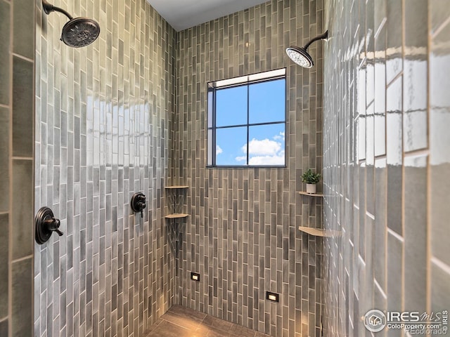 bathroom with tiled shower