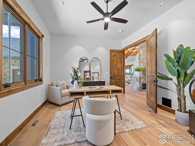 home office with light wood-style floors, baseboards, a wealth of natural light, and recessed lighting