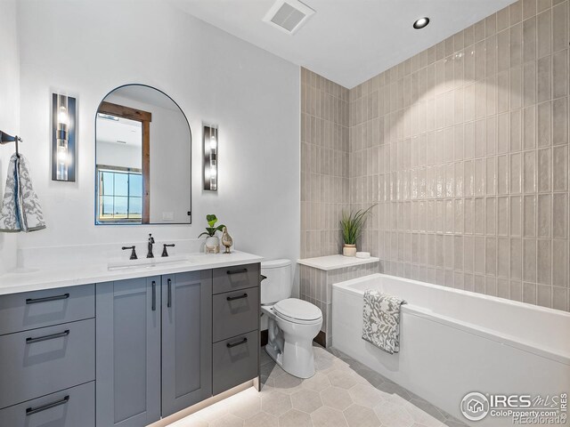 full bath featuring visible vents, toilet, vanity, tile patterned flooring, and a bath