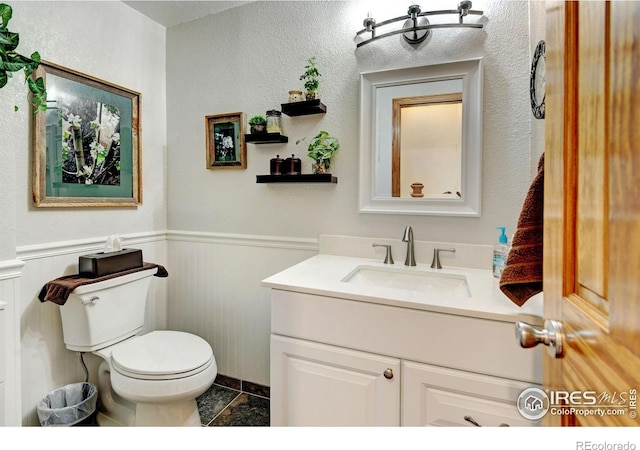 bathroom with vanity and toilet