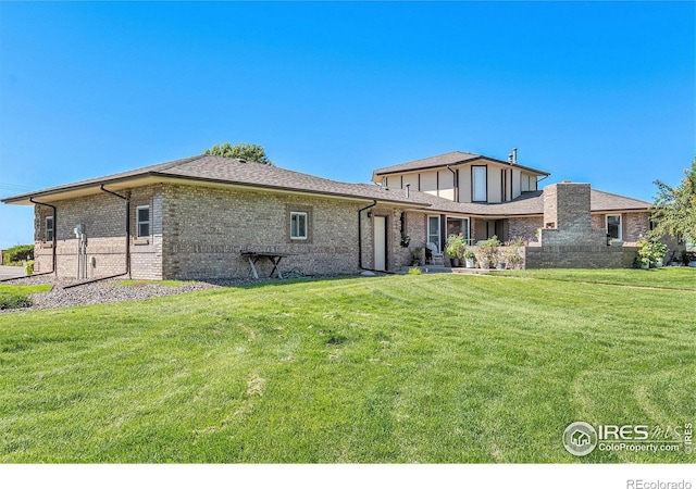 33501 County Road 8, Keenesburg, CO 80643 - rear view of property with a lawn