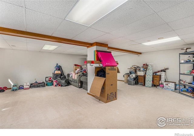 playroom featuring a paneled ceiling and carpet