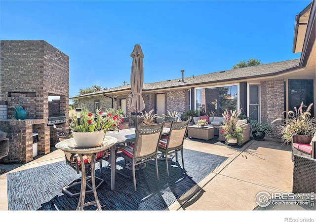 view of patio / terrace with a fireplace