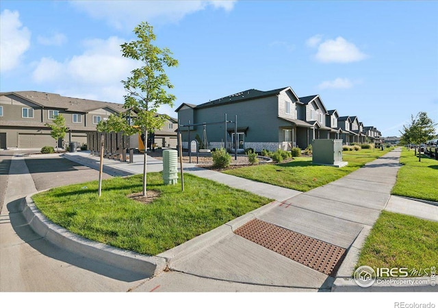exterior space featuring a residential view and a yard