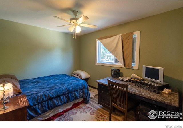 bedroom featuring wood finished floors and a ceiling fan