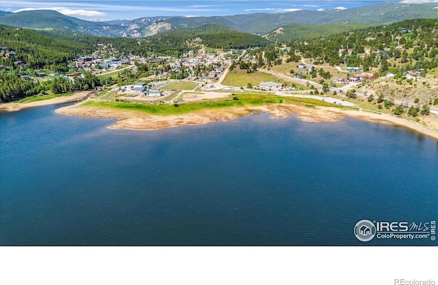 aerial view with a water and mountain view