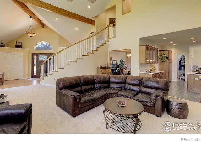 carpeted living room with baseboards, stairway, beamed ceiling, recessed lighting, and high vaulted ceiling