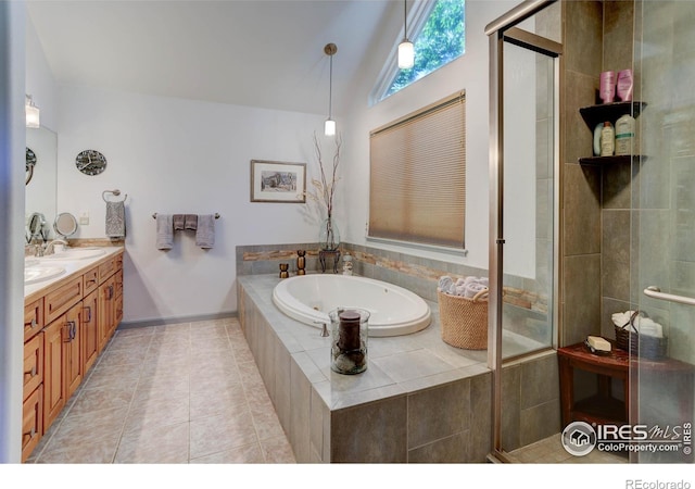 full bathroom featuring tile patterned floors, lofted ceiling, a garden tub, and a stall shower