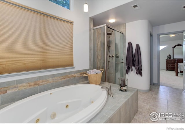 full bath featuring tile patterned flooring, visible vents, a stall shower, and a jetted tub