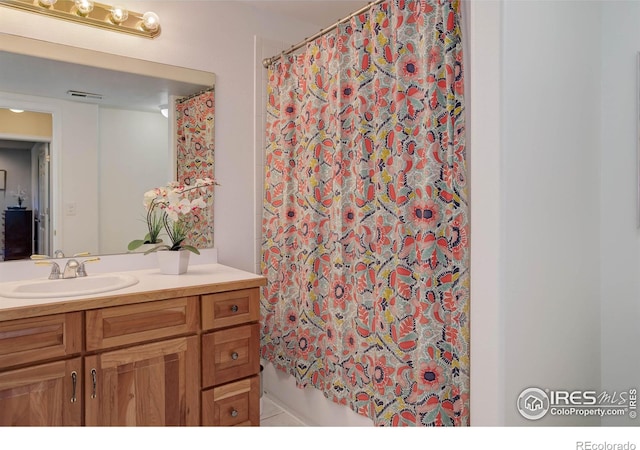 bathroom with vanity and shower / bath combo