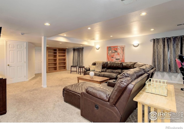 carpeted living area with visible vents, recessed lighting, and baseboards