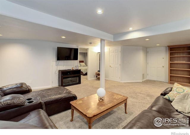 living room with recessed lighting, light colored carpet, and baseboards