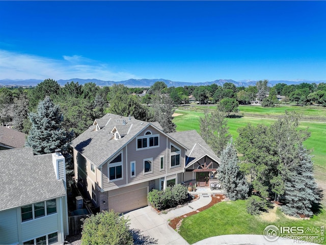 birds eye view of property with a mountain view