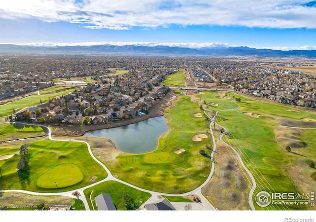 birds eye view of property featuring golf course view and a water and mountain view