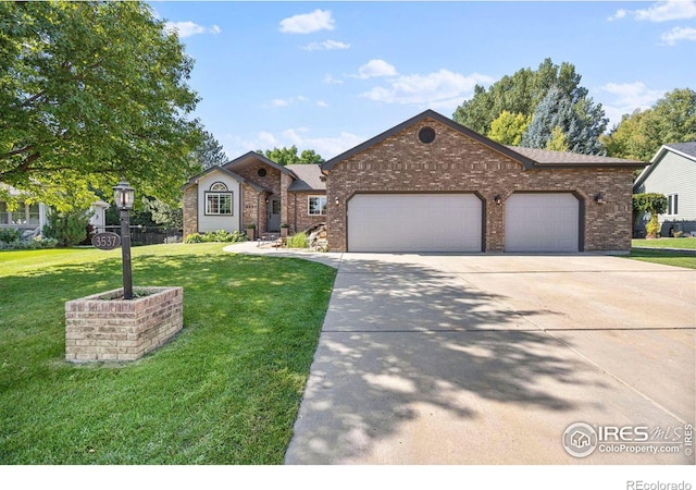 view of front of home featuring a garage and a front yard