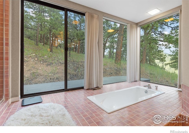 unfurnished sunroom with a jacuzzi