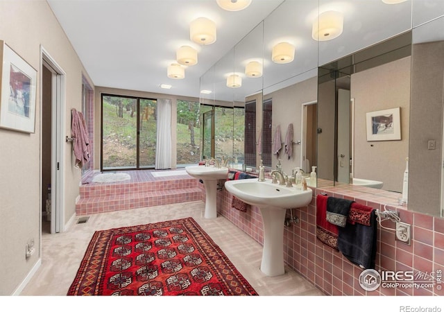 bathroom featuring tile walls and tile patterned flooring