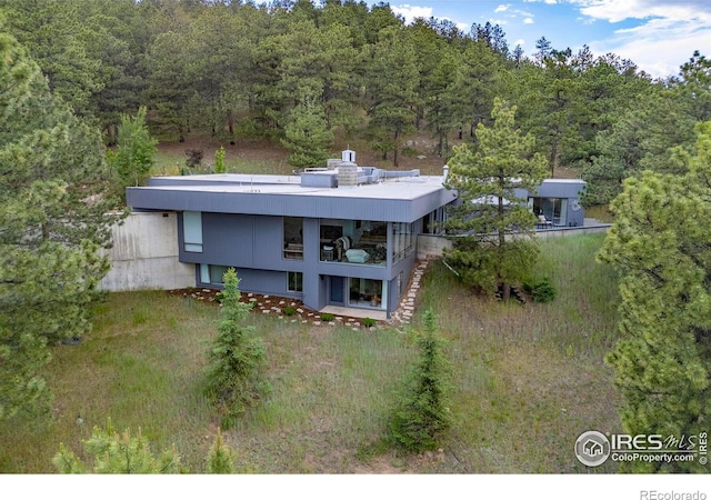 271 Anemone Dr, Boulder, CO 80302 - aerial view of property and surrounding area featuring a heavily wooded area
