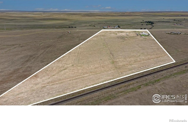 birds eye view of property featuring a rural view