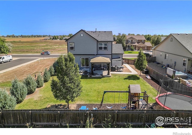 back of house with a playground, a lawn, a patio, and a gazebo