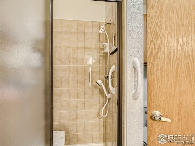 bathroom with a stall shower