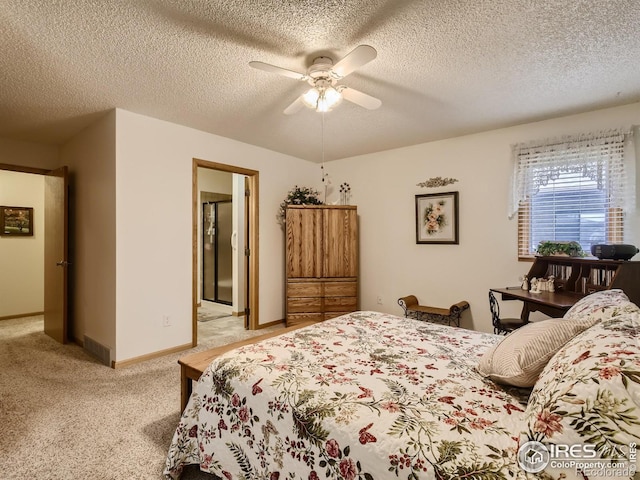 bedroom with light carpet, visible vents, a textured ceiling, and baseboards