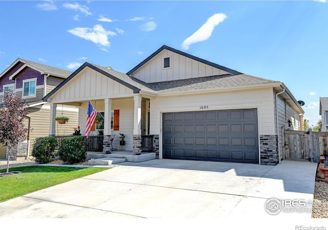 view of front of home with a garage and covered porch