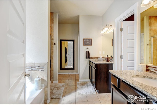 bathroom with tile patterned floors, independent shower and bath, and vanity