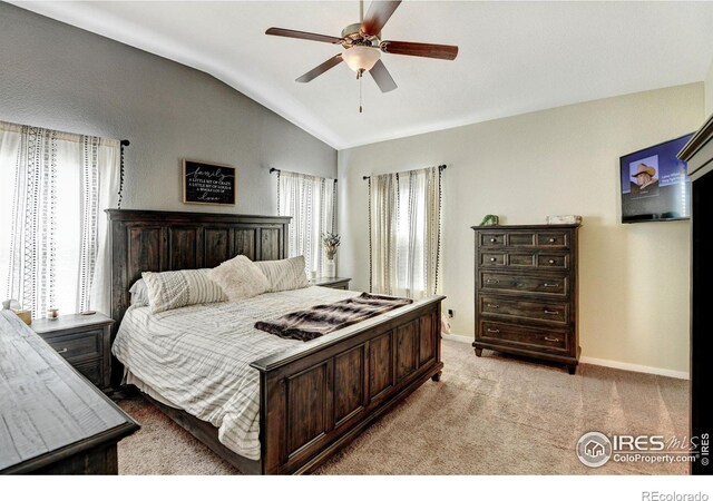 carpeted bedroom with lofted ceiling and ceiling fan