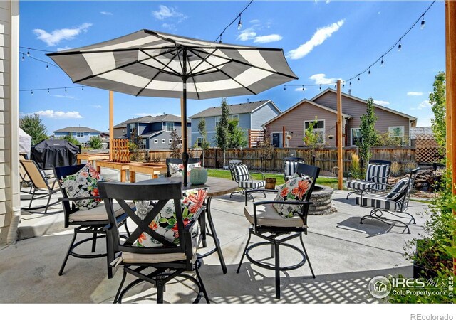 view of patio with a fire pit