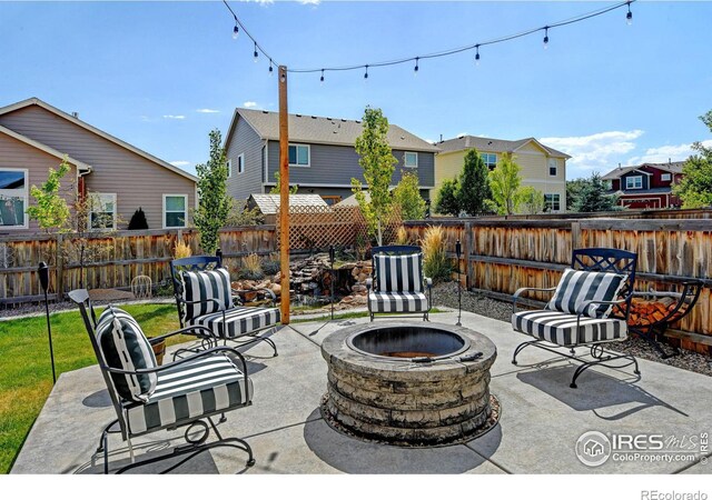 view of patio featuring an outdoor fire pit