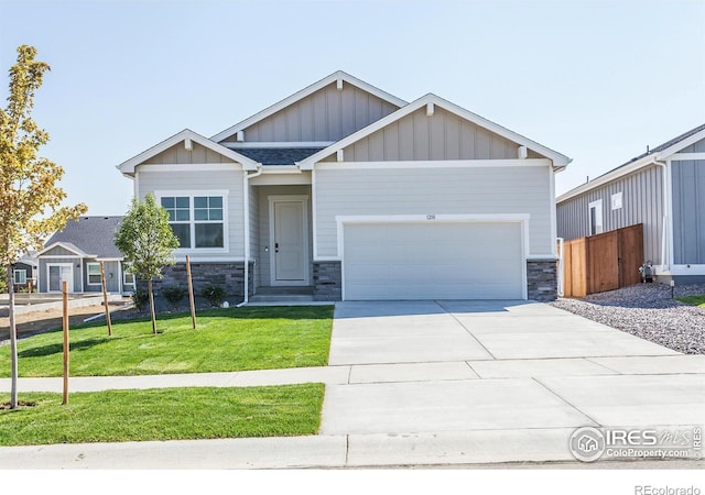 view of front of house with a garage and a front yard