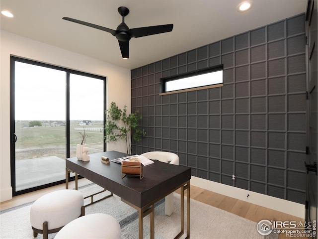 office area with ceiling fan and wood-type flooring