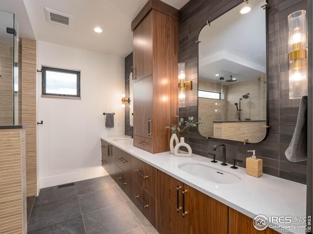 bathroom with vanity, a shower, decorative backsplash, and tile patterned floors