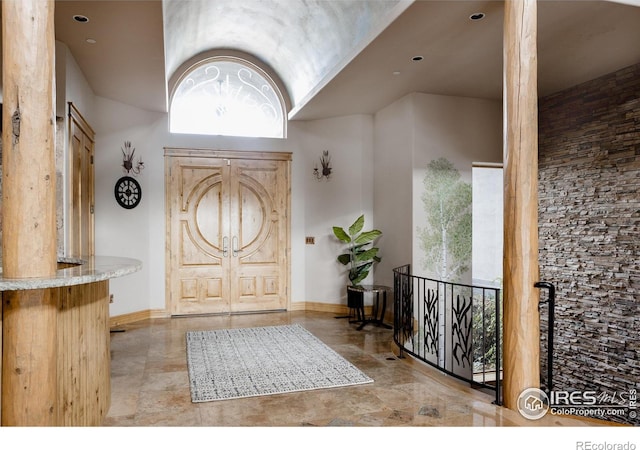 entryway with lofted ceiling