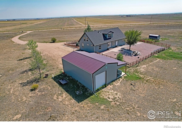 birds eye view of property featuring a rural view