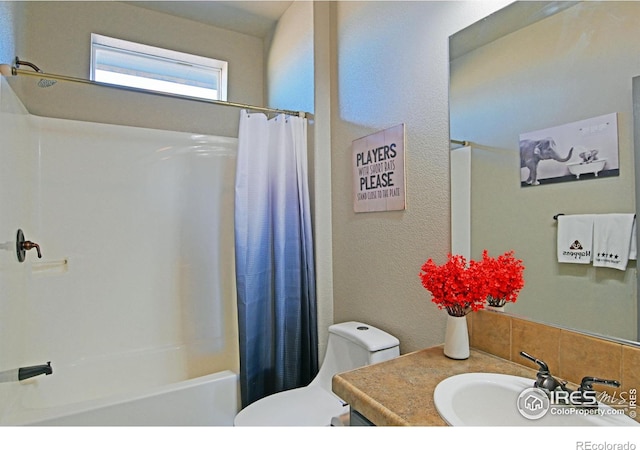 full bathroom featuring vanity, toilet, and shower / tub combo with curtain