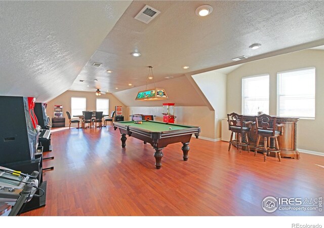 playroom featuring ceiling fan, lofted ceiling, a textured ceiling, pool table, and hardwood / wood-style floors