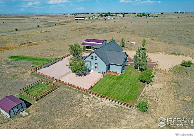 birds eye view of property featuring a rural view