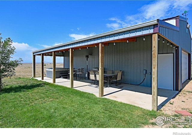 exterior space featuring a lawn and a patio area