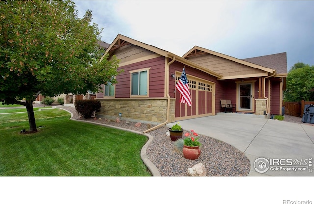 craftsman-style home with a front lawn and a garage