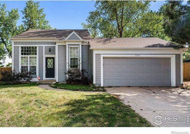 view of front of house featuring a garage and a front yard