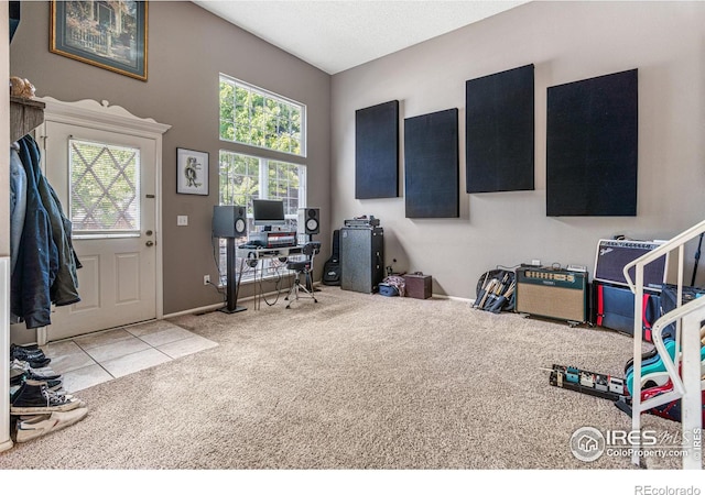 office with a textured ceiling and light carpet